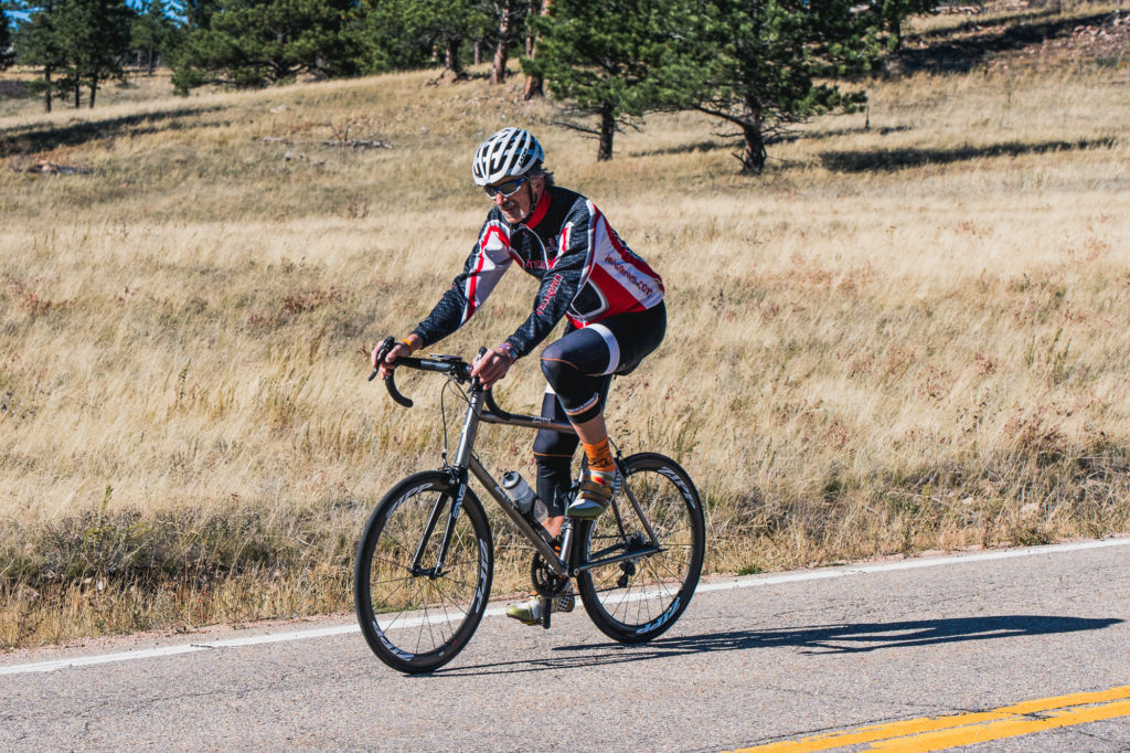 Lennard Zinn riding on his bike with a 205mm bicycle crank length
