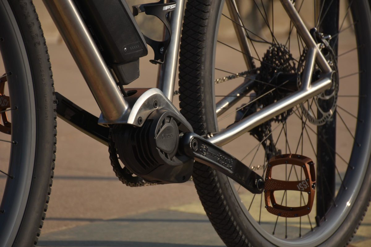 closeup of ebike wheels and cranks