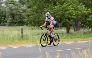 Person Riding Custom Travel Bike Road