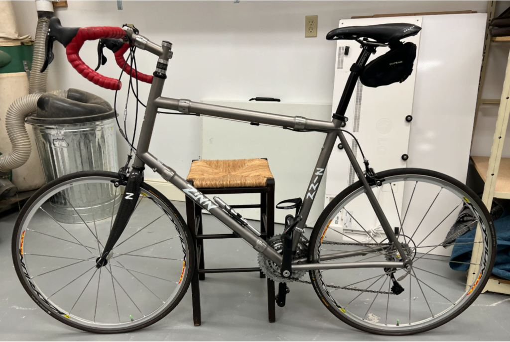 Silver Zinn travel bike inside shop